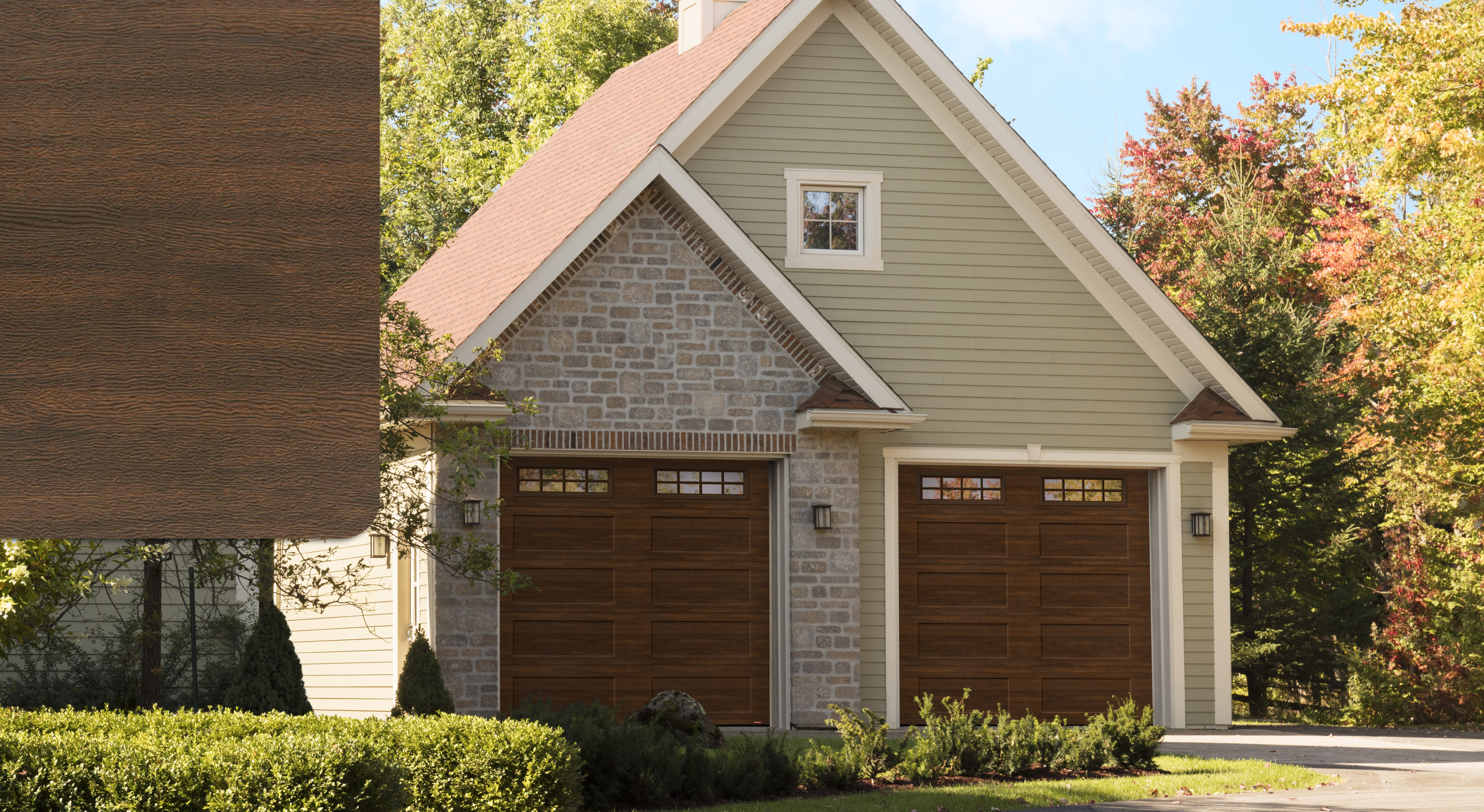 Grey brick house with Standard+ Shaker-Flat XL garage doors, 10' x 9', Chocolate Walnut, windows with Stockton Inserts and a Chocolate Walnut sample